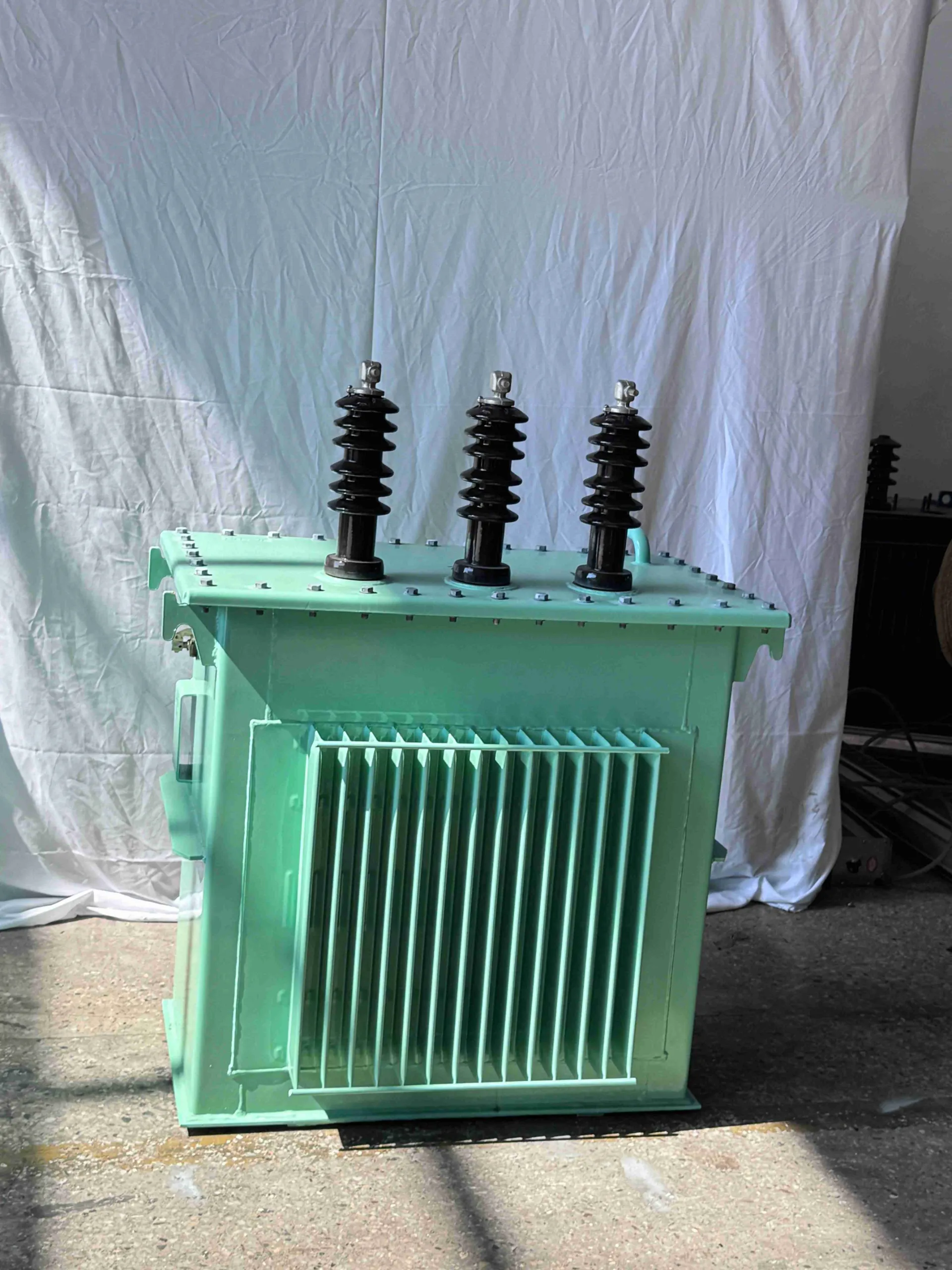 Green three-phase pole-mounted distribution transformer
