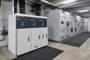Ring main unit beside a medium-voltage switchgear lineup